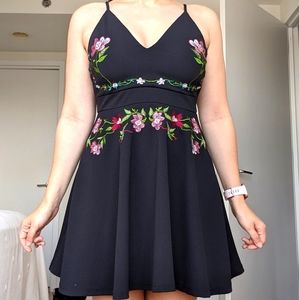 Black triangle top dress with floral embroidery